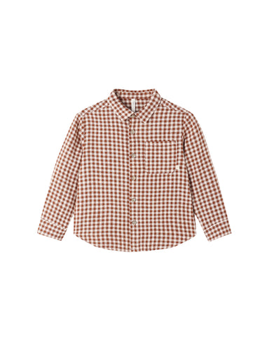 Aa brown and cream gingham checkered shirt sleeve with a buttoned cuff, shown on a light gray background.