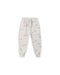A pair of light beige jogger pants with an all-over print of small brown foxes and tiny dandolions, featuring an elastic waistband with a drawstring and elastic cuffs.