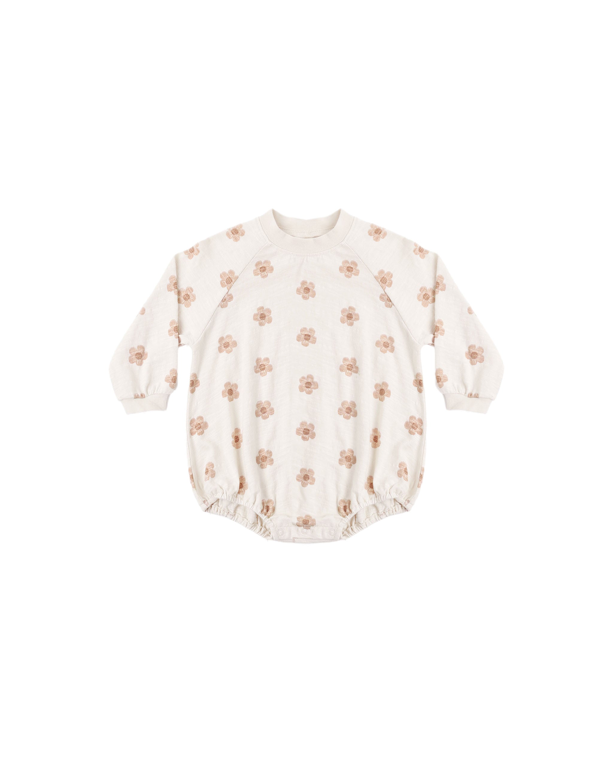 A long-sleeve Crewneck Romper in soft jersey bold pink daisy pring on a natural colored fabric designed with elastic leg openings and bottom snaps for easy changes.
