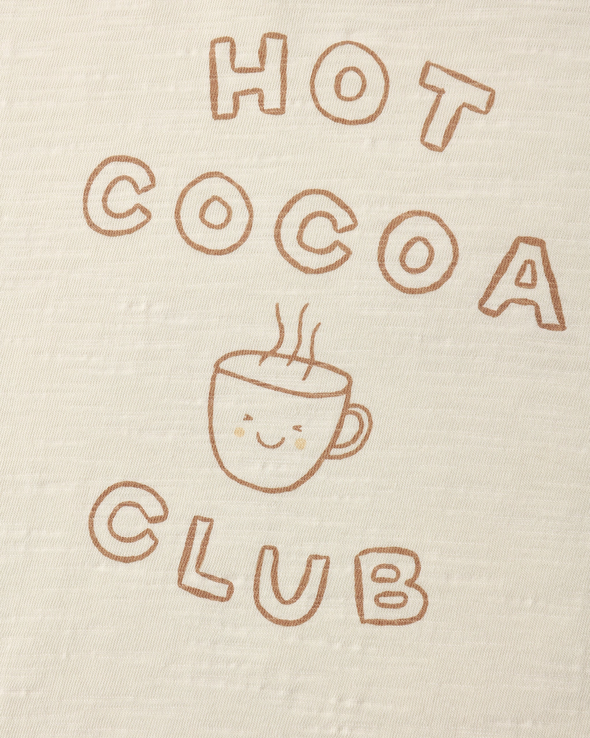 A close up of a natural colored long sleeve tee with a Hot Cocoa Club logo
