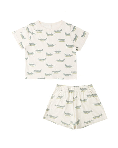 Children's short set with alligator pattern on a white background