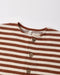 A close up of a brown and white striped romper with a button up front on a white background.