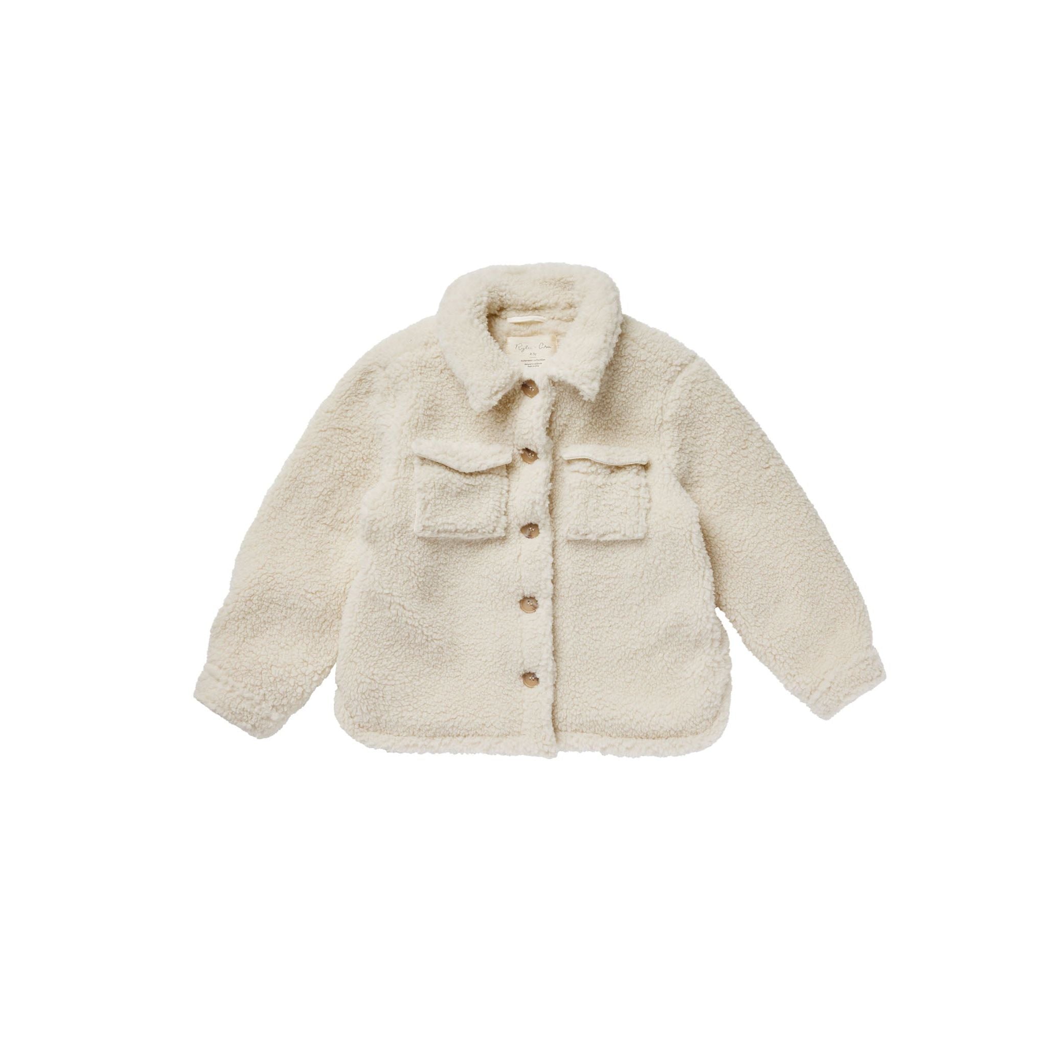 cream colored fleece chore coat with button up features and pockets