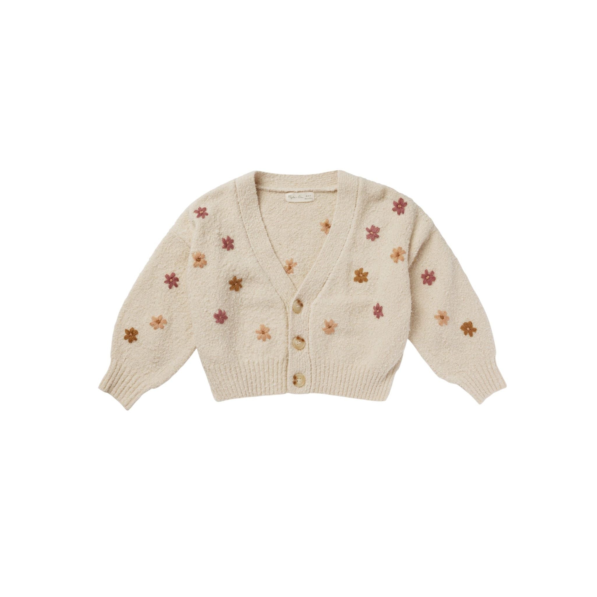 cream colored boxy cropped cardigan with multicolored daisies and bubble sleeves