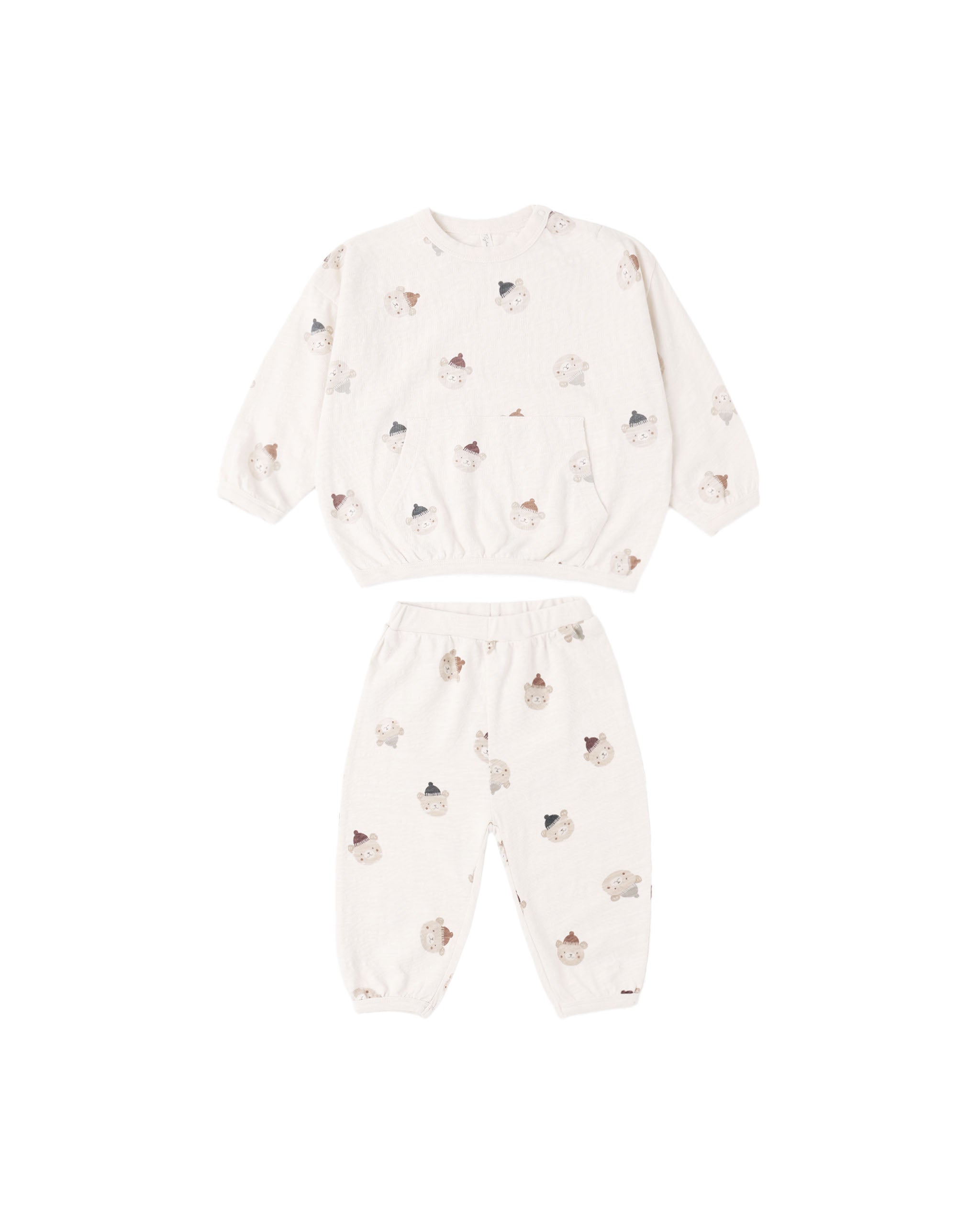 A two-piece baby set featuring a long-sleeve top and matching pants in an off-white/cream color, both printed with a small, scattered pattern of teddy bears in soft brown and gray tones.