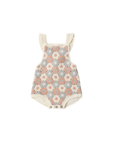 Baby romper with floral pattern on a white background