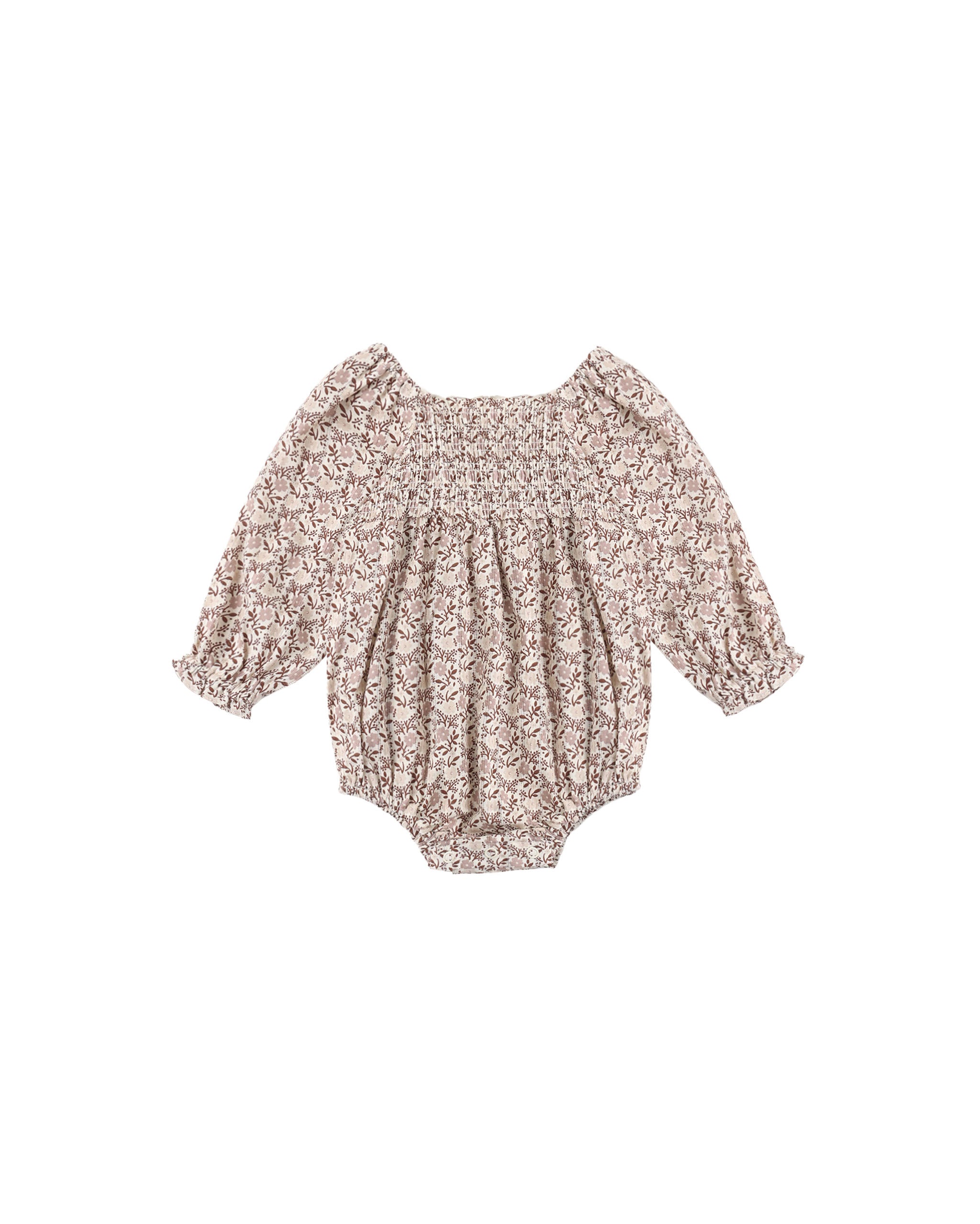 A baby long-sleeve romper with a dense beige and brown floral pattern, featuring a smocked bodice and ruffled sleeves, shown flat on a white background.