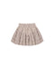 Tiered skirt in an all-over floral and leafy pattern in brown and dusty mauve on a warm off-white background.