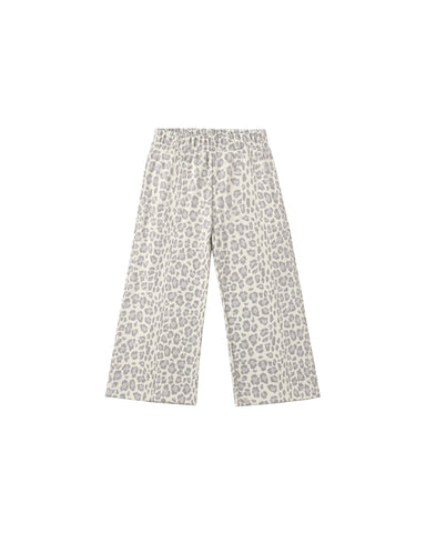 A pair of wide-leg sweatpants featuring a blue leopard print pattern on a light beige background, displayed flat against a solid white background.