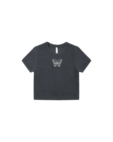 A dark charcoal gray short-sleeve crop top featuring a small white embroidered butterfly on the center chest, displayed flat against a solid white background.