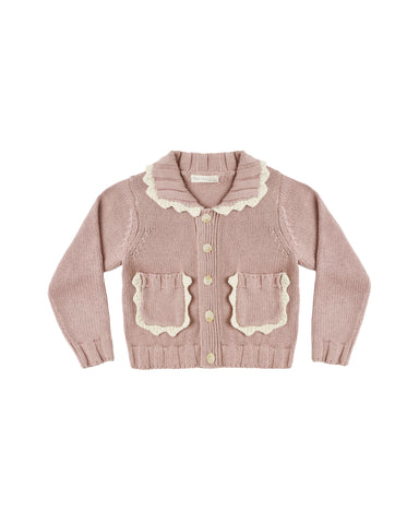 A dusty pink ribbed knit cardigan sweater for toddlers, featuring a cream-colored scalloped Peter Pan collar, matching scalloped pocket flaps, and cream buttons, shown flat on a white background.