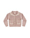 A dusty pink ribbed knit cardigan sweater for toddlers, featuring a cream-colored scalloped Peter Pan collar, matching scalloped pocket flaps, and cream buttons, shown flat on a white background.