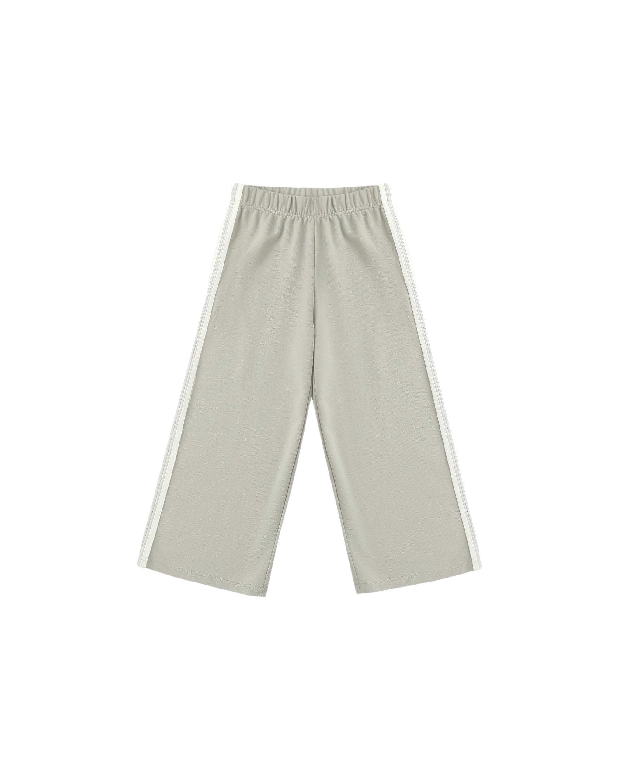 A pair of wide-leg track pants in a light sage green, featuring a white stripe down the side of each leg and an elastic waistband, shown against a plain white background.