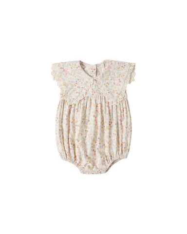 Baby romper with floral pattern on a white background
