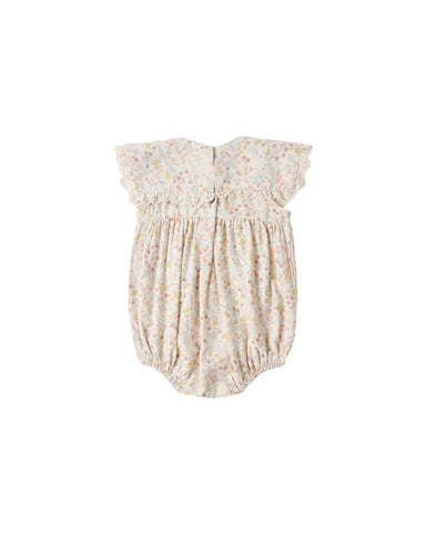 Baby romper with floral pattern on a white background