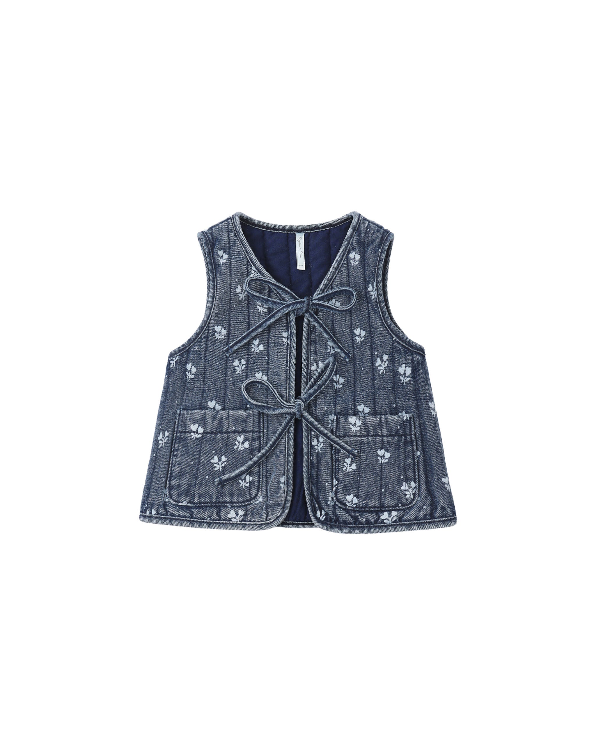 Denim vest with white floral pattern on a white background