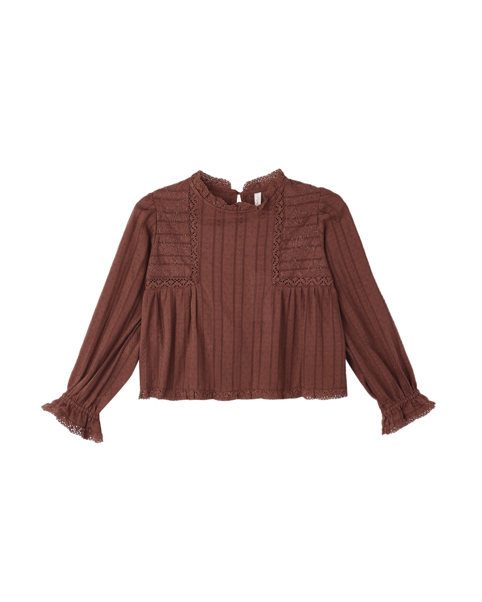 Brown blouse with ruffled details on a white background