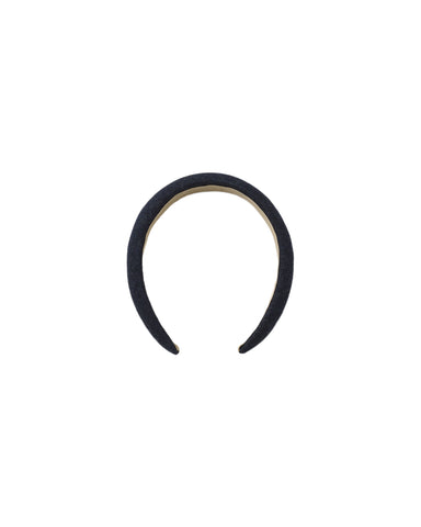An indigo denim padded headband shown on a white background