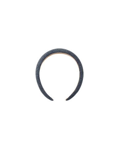 A single dark blue denim headband with a light tan inner lining, shown against a plain white background.