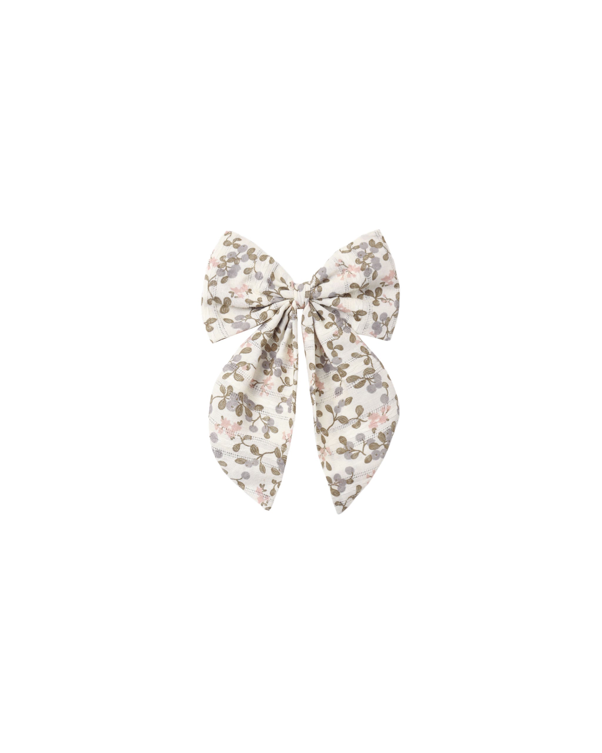 A fabric hair bow with a delicate floral print in muted pink, olive green, and gray on a cream background, centered on a solid white background.