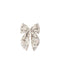 A fabric hair bow with a delicate floral print in muted pink, olive green, and gray on a cream background, centered on a solid white background.