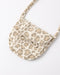 A small shoulder bag with a beige and brown leopard print pattern, featuring a flap front with a decorative bow detail and a matching shoulder strap, shown on a plain white background.