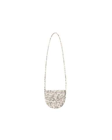 A small, semi-circular shoulder bag in a ivory floral pattern with a should strap, shown against a plain white background.