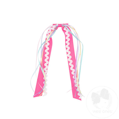 Colorful hair clip with ribbons on a white background