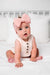 Baby girl in a rose colored cable knit headband