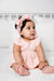 Baby girl in a rose colored cable knit headband