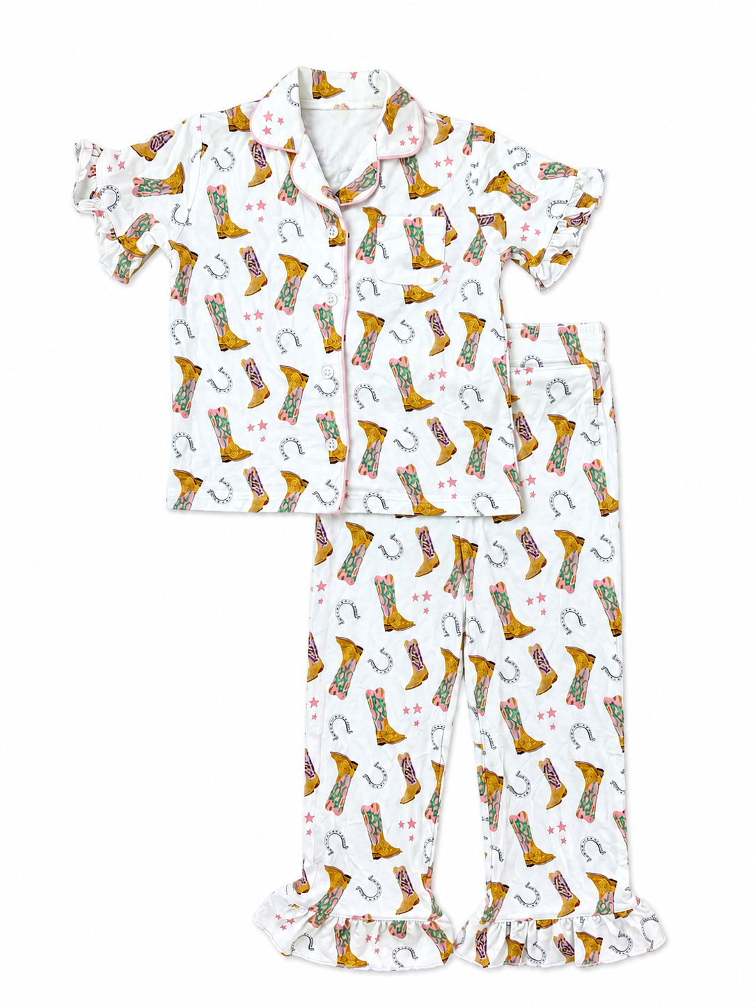 A two-piece children's pajama set featuring a short-sleeve button-up top and matching ruffled pajama pants, both printed with a western boot and horseshoe pattern on a white background.