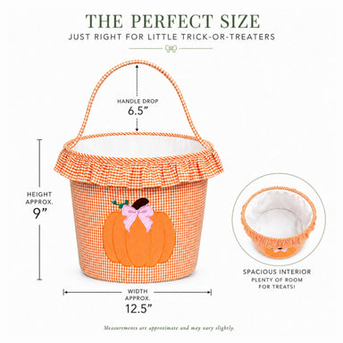 A gingham orange and white pumpkin treat basket with a printed orange pumpkin and pink bow on the front, shown with measurement callouts for height, width, and handle drop, plus a circular inset showing the spacious interior.