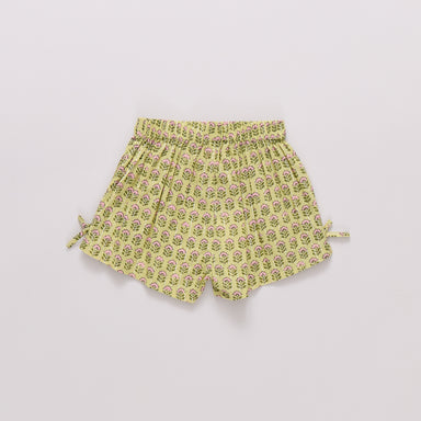 Yellow floral shorts on a light gray background