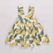Dress with banana pattern on a plain background