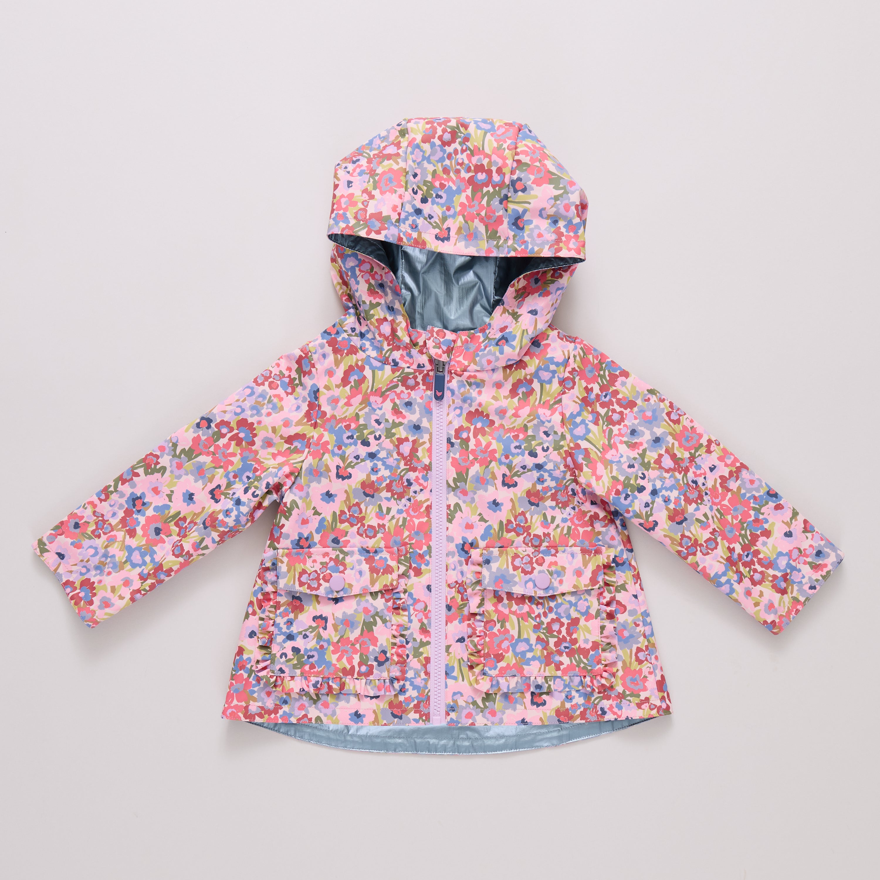 Floral patterned raincoat on a light gray background