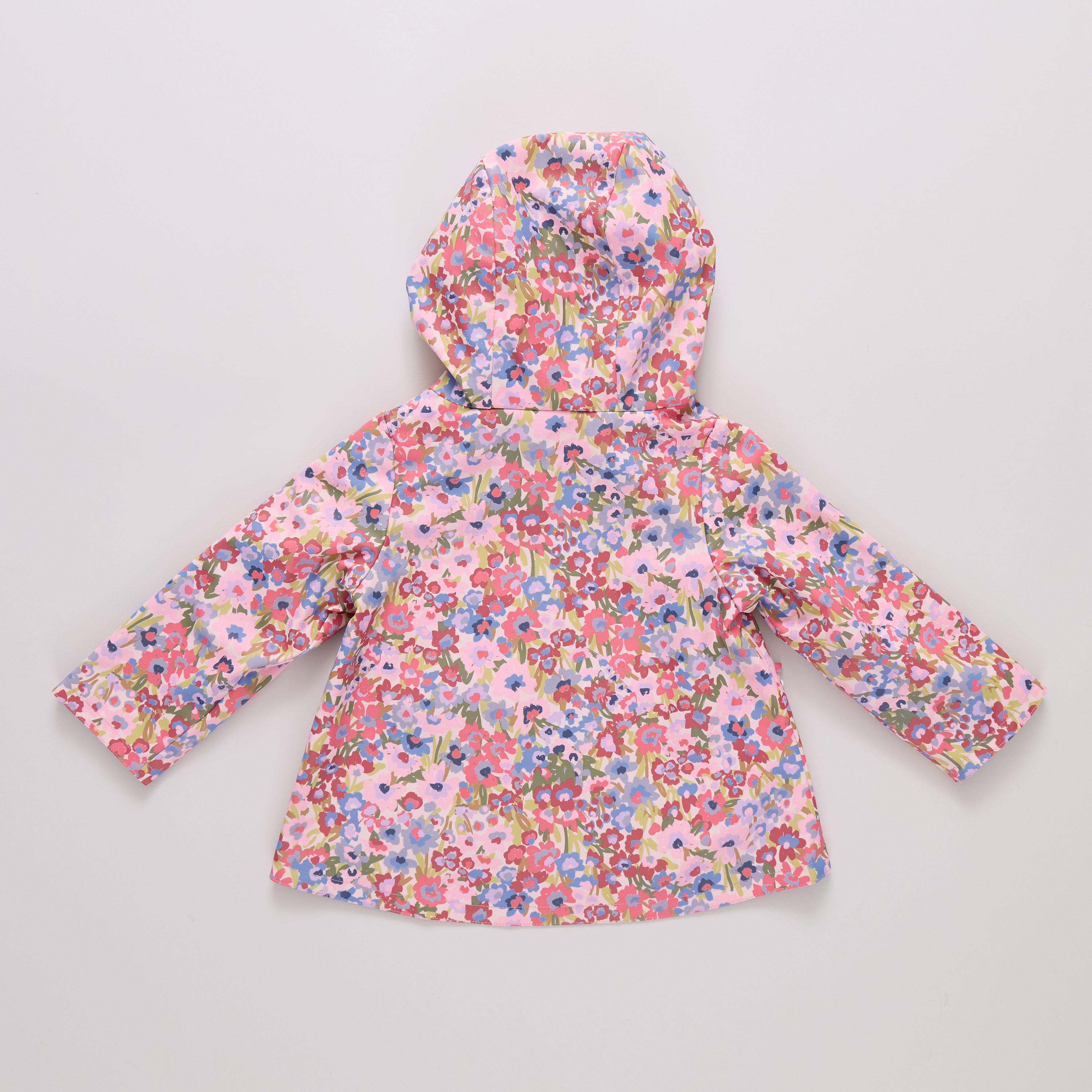 Floral-patterned children's raincoat on a light gray background