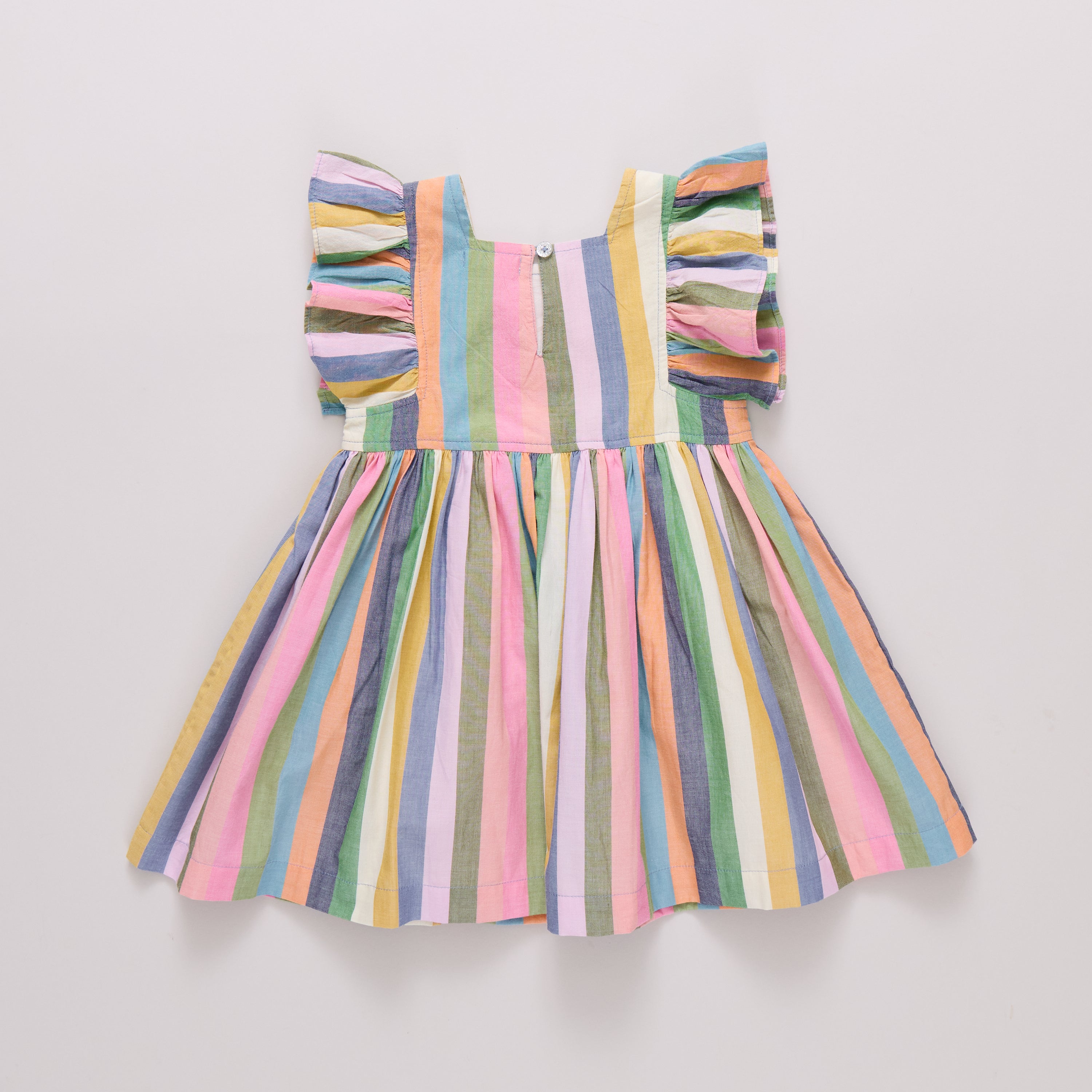 Multicolored striped dress on a light gray background