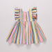 Multicolored striped dress on a light gray background