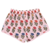 Floral patterned shorts on a pink background