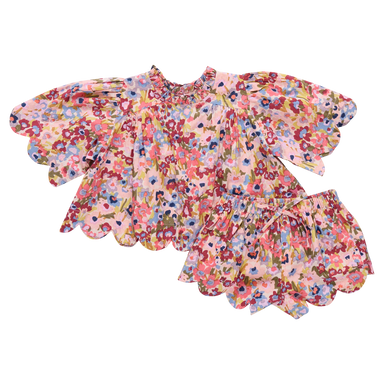 Floral top with ruffled sleeves and short on a white background