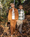 Two boys wearing casual clothes. One boy is wearing corduroy  pants with a relaxed fit and featuring an elastic waist with drawcord, side and back pockets.