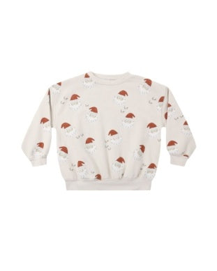 A cream-colored long-sleeve sweatshirt featuring an all-over print of Santa Claus faces wearing red Santa hats, displayed against a solid white background.