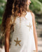 White crochet dress with gold sequin stars