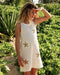 White crochet dress with gold sequin stars