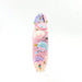 Decorative pink object with seashell and bow designs on a white background