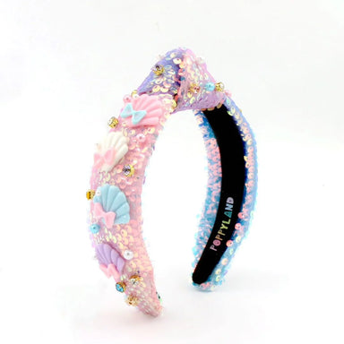 Colorful sequined headband with mermaid-themed decorations on a white background