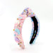Colorful sequined headband with mermaid-themed decorations on a white background