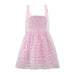 Pink sequin dress with a grid pattern on a white background