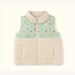 A sleeveless zip-front fleece vest with a light beige sherpa collar and lower body, and a mint green upper panel printed with small rodeo motifs, shown on a plain light background.