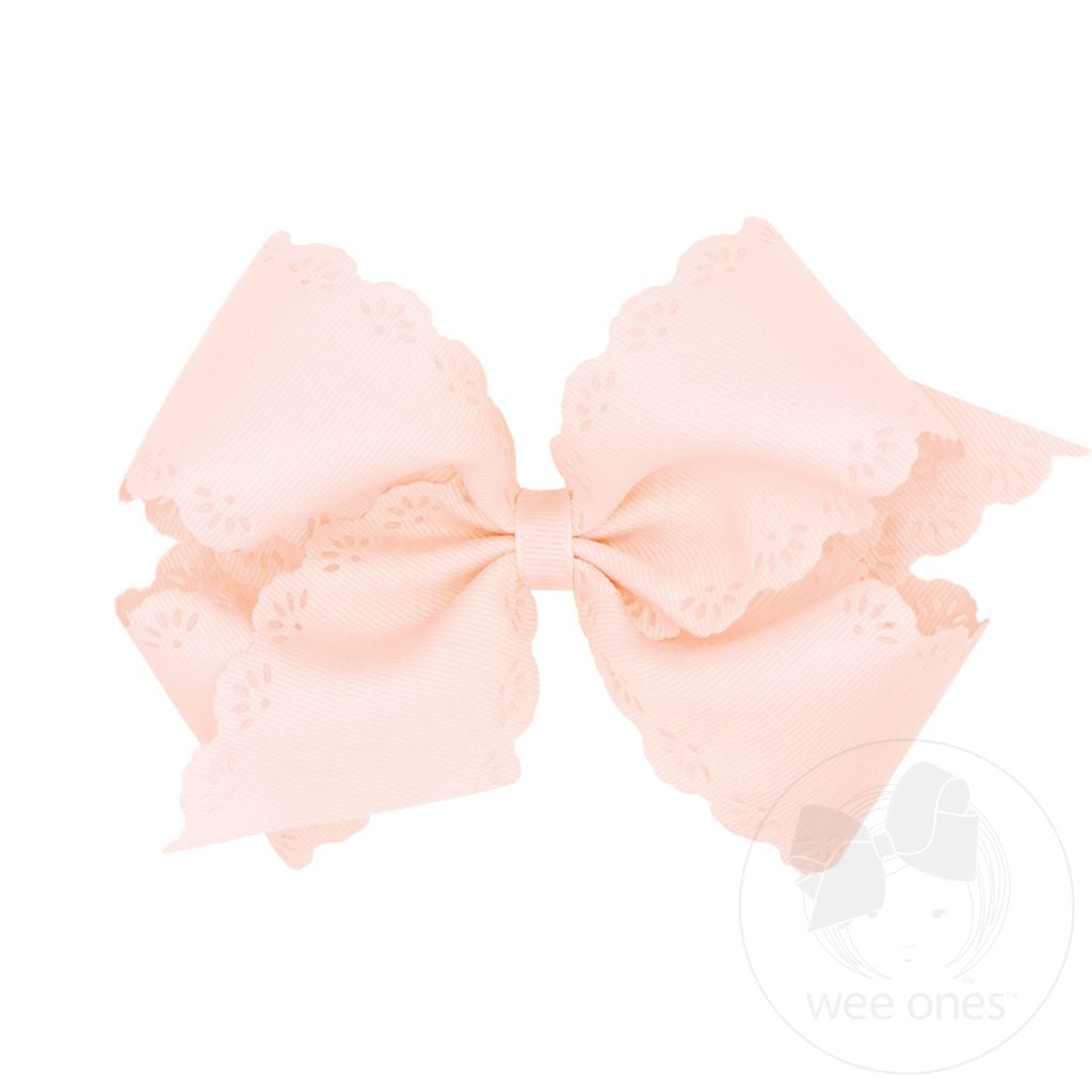 Large pink bow with a white background